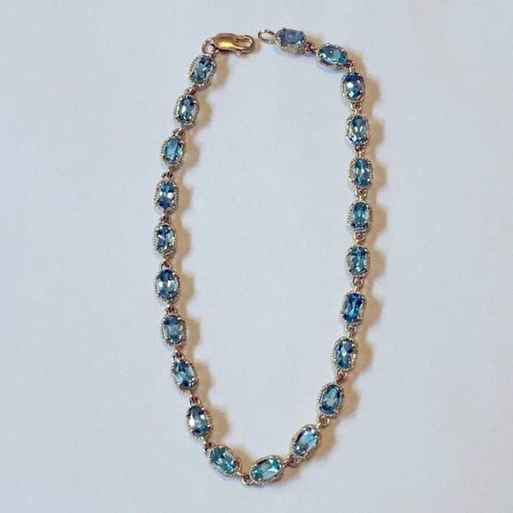 Elegant Sky Blue Topaz 10kt Yellow Gold Women's Tennis Bracelet